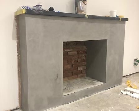 Fireplace with polished plaster surround