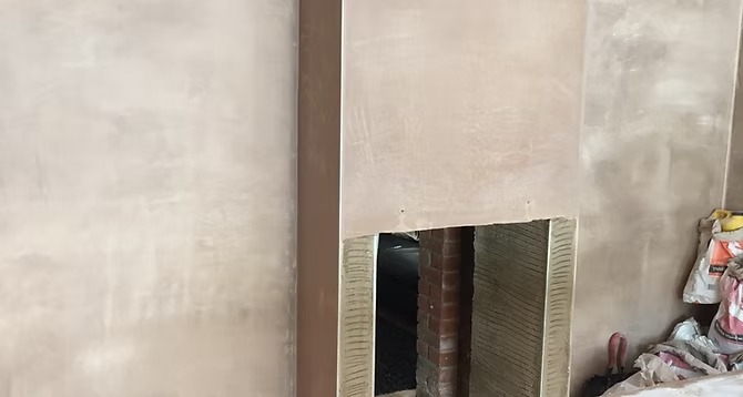 Decorative fireplace surround with textured finish